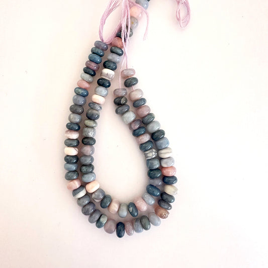 A string of polished Lavender Opal rondelle beads with soft lilac hues and glossy finish.