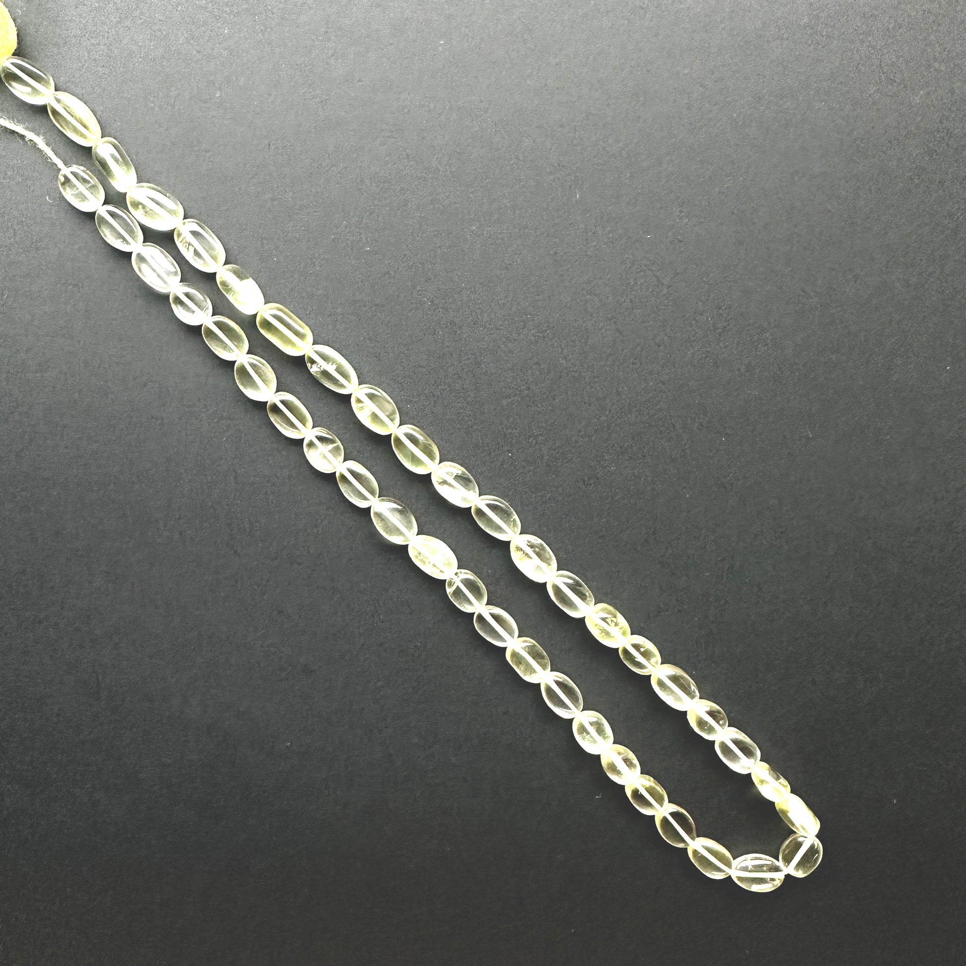 Handmade jewellery components made from Lemon Quartz beads with 0.5mm drilled holes.