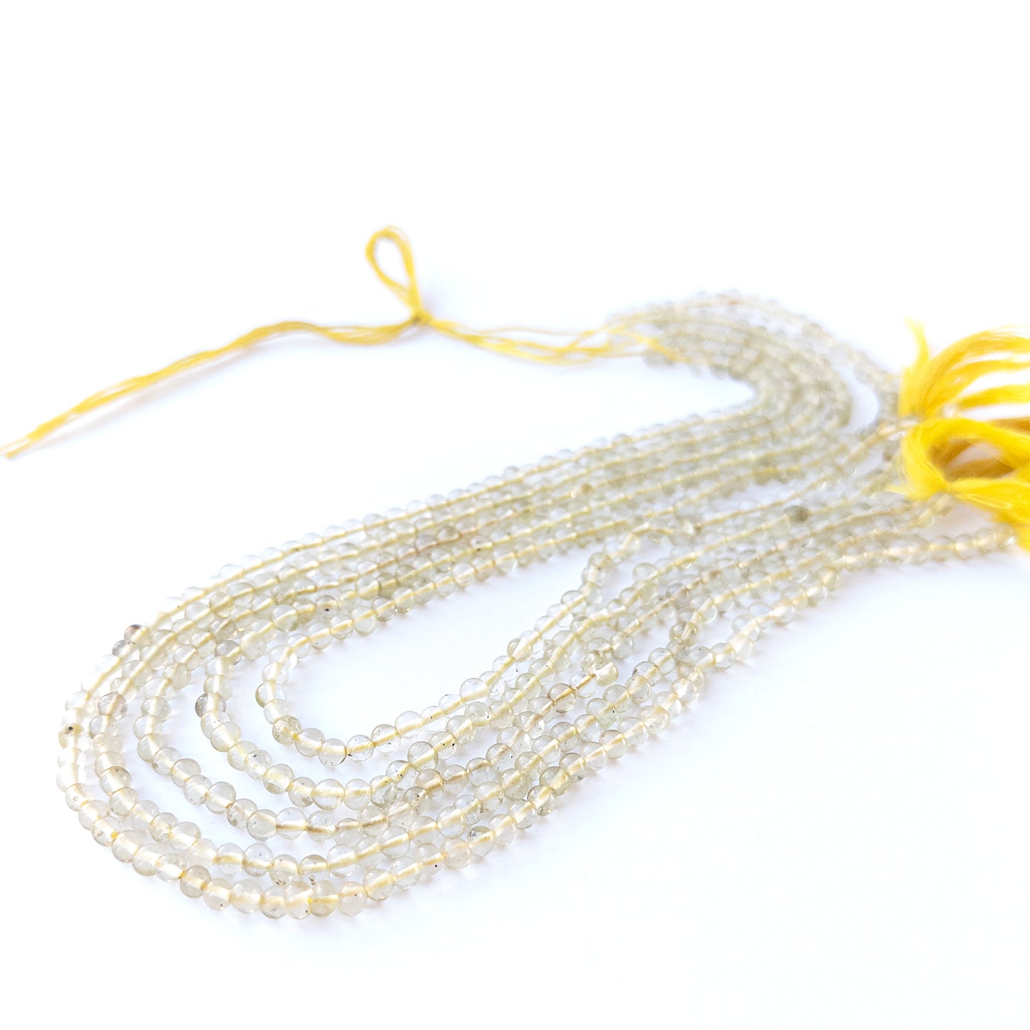Authentic Lemon Quartz gemstone beads showcasing translucent shine and smooth round cuts for handmade jewellery components.