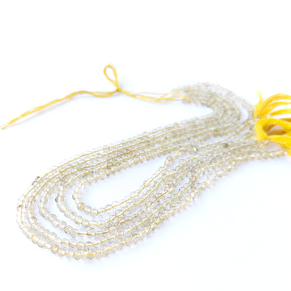 Authentic Lemon Quartz gemstone beads showcasing translucent shine and smooth round cuts for handmade jewellery components.