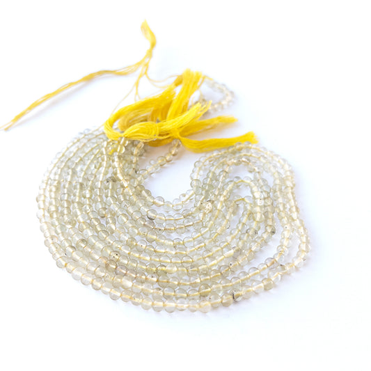 Lemon Quartz smooth round gemstone beads in 3.8–4mm size arranged on a 32cm strand with bright yellow clarity.