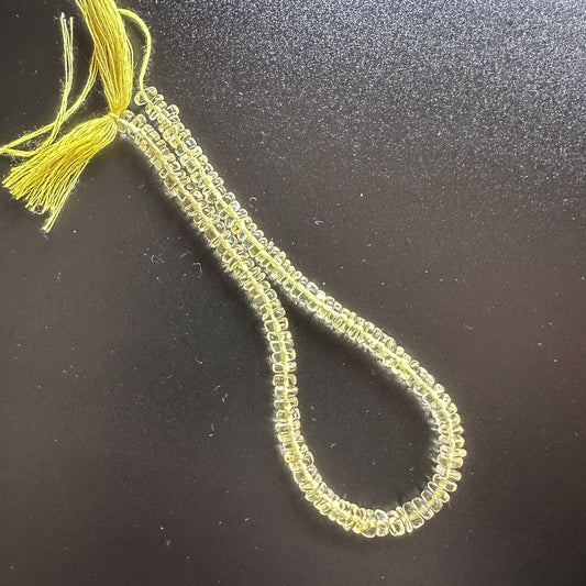 Lemon Quartz beads with consistent wheel shape and radiant clarity.