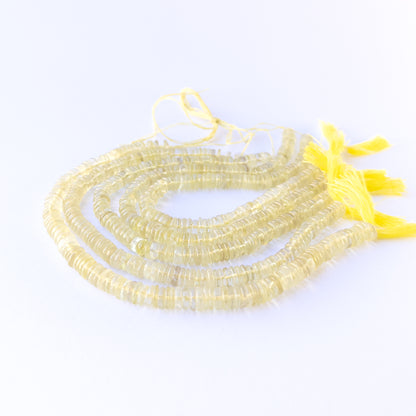 Premium lemon quartz gemstone beads for DIY jewellery, displaying smooth wheel cuts and fresh sunny colour.