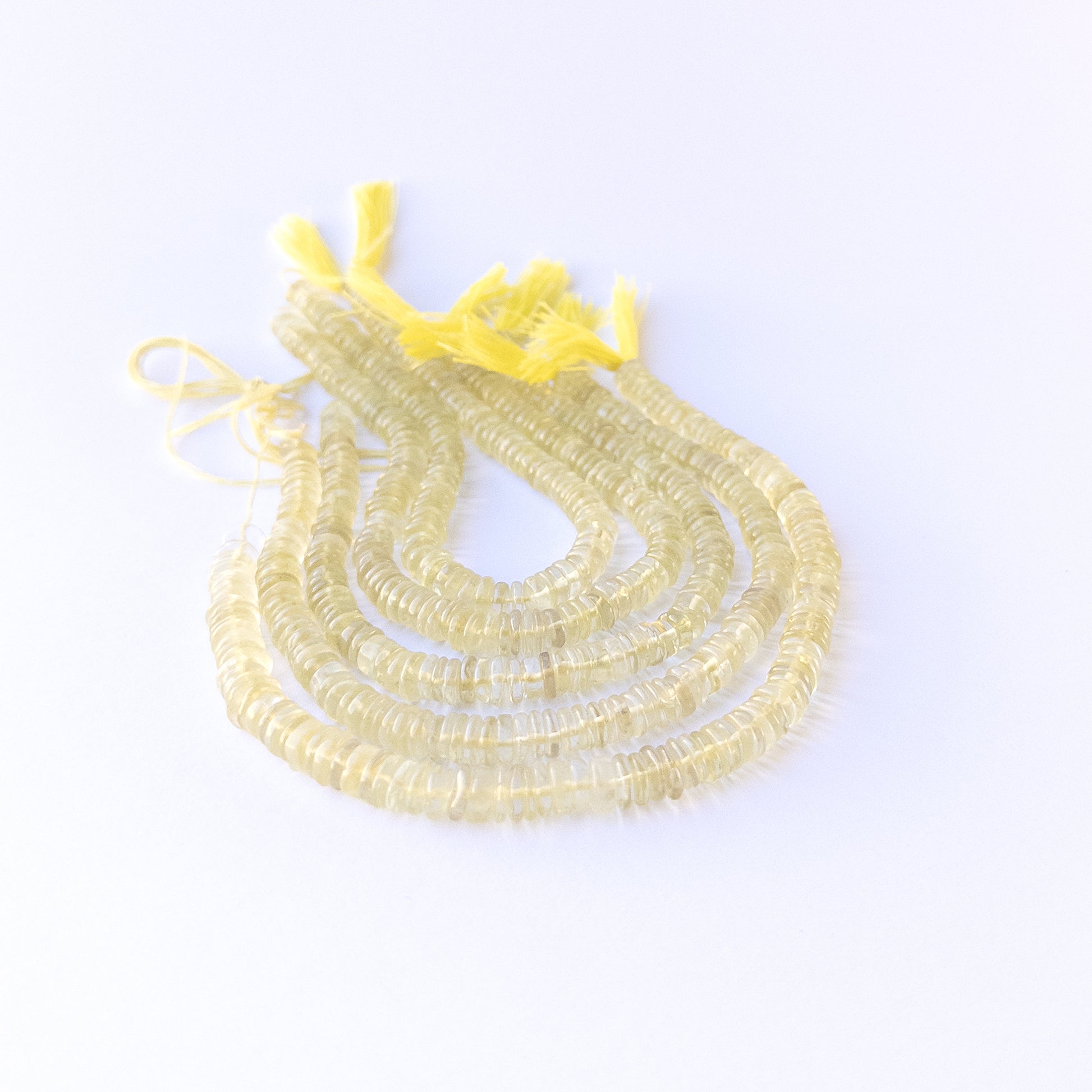 High‑quality lemon quartz wheel gemstone beads with natural clarity and gentle polished glow.