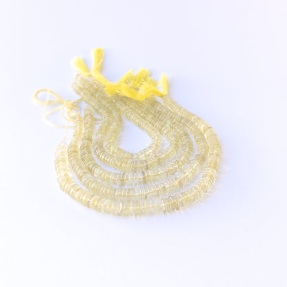 High‑quality lemon quartz wheel gemstone beads with natural clarity and gentle polished glow.