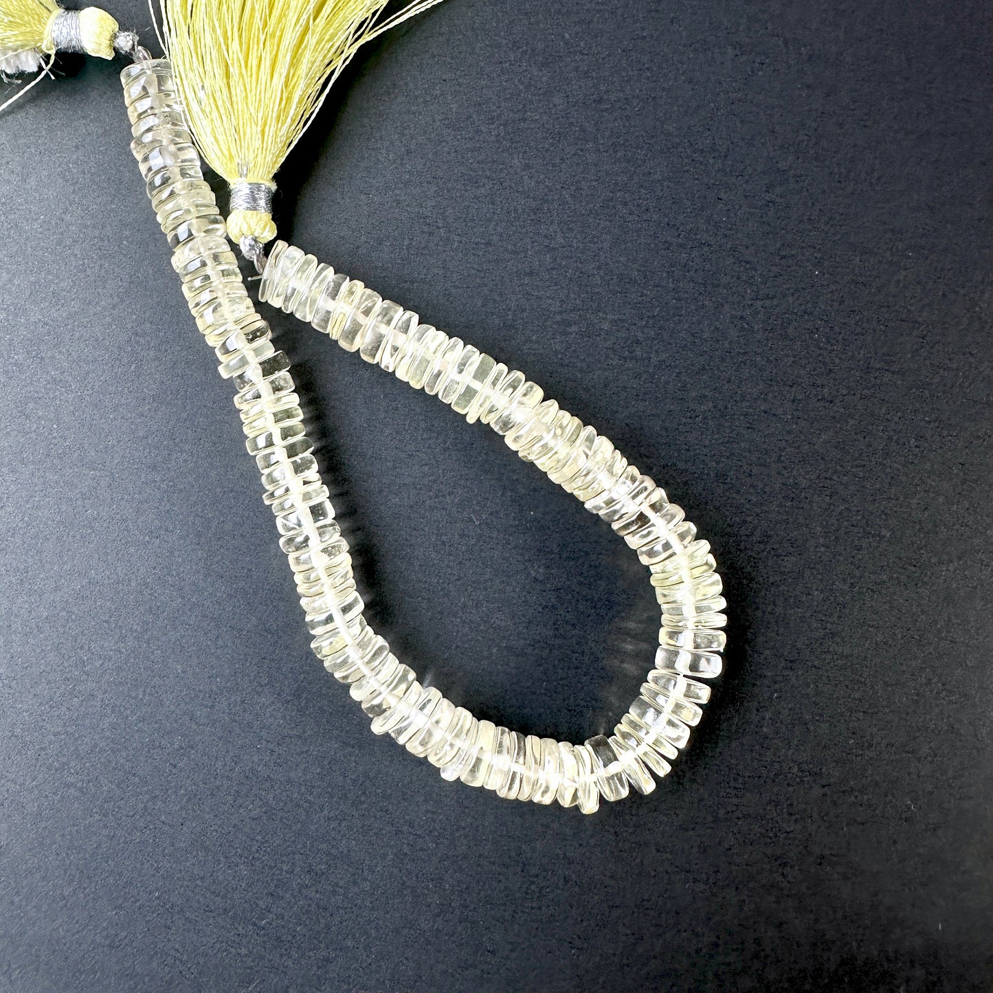 Close-up of Lemon Quartz beads showcasing their glossy surface and vibrant colour.