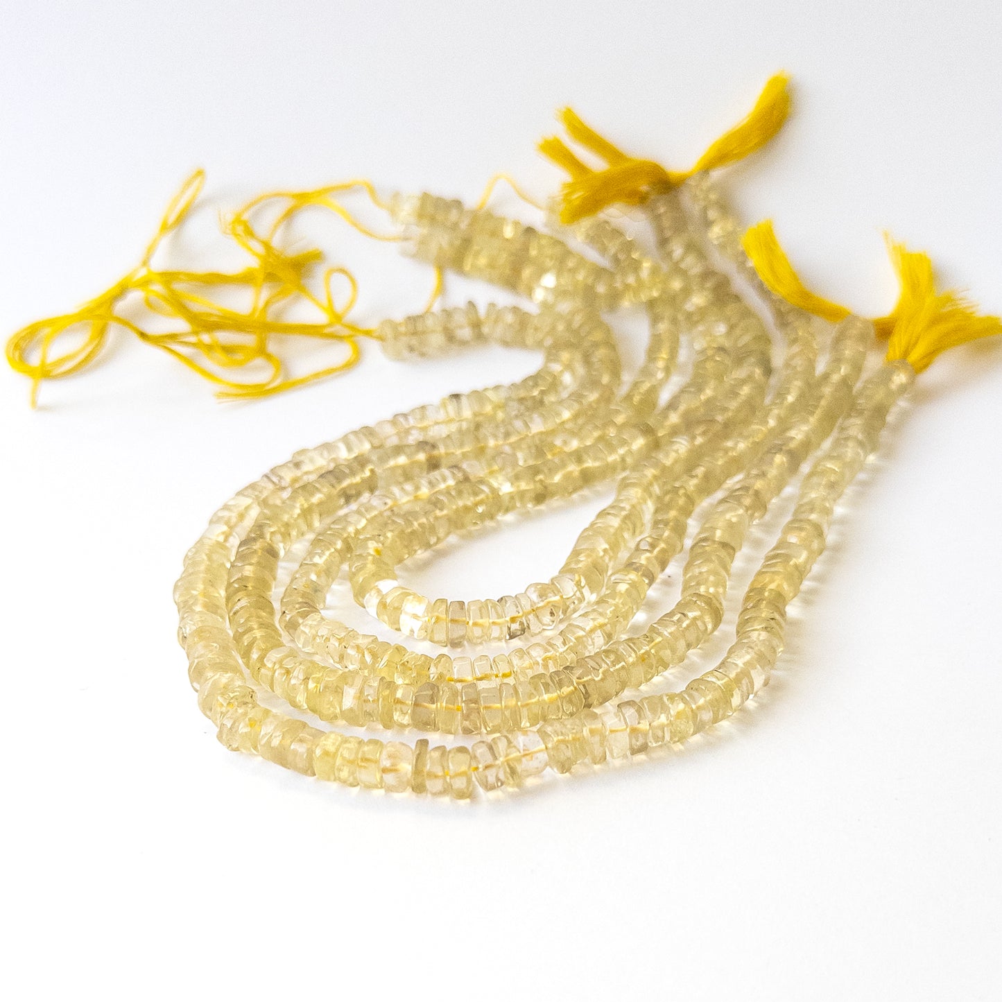 Handmade jewellery components using premium Lemon Quartz smooth wheels with bright clarity and shine.