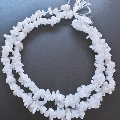 Close-up of Moonstone chip beads showcasing their natural texture and luminous glow.