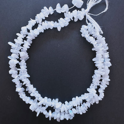 Natural gemstone beads featuring Moonstone chips with organic shapes and subtle shimmer.