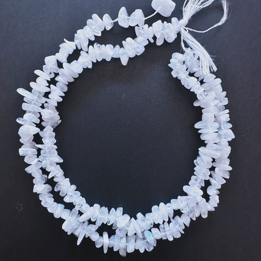 Natural gemstone beads featuring Moonstone chips with organic shapes and subtle shimmer.
