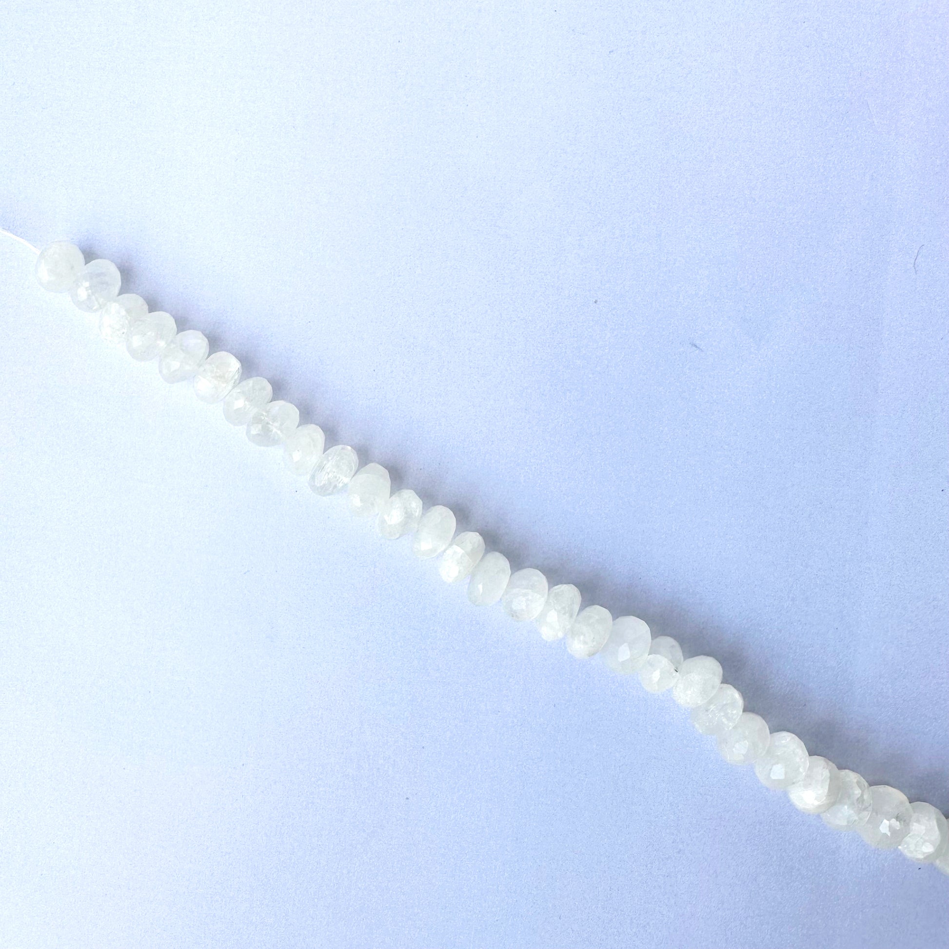 High-quality moonstone rondelles with 0.5mm bead holes and radiant shine.