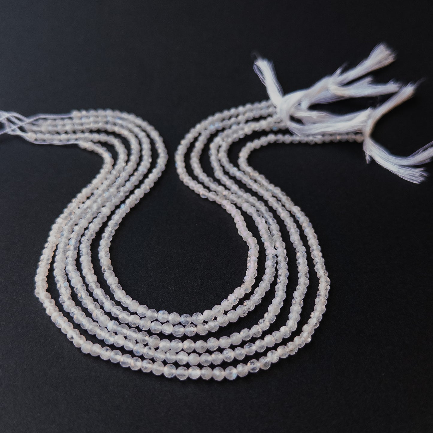 High‑quality moonstone rondelle gemstone beads with bright shine and natural adularescence on a long strand.