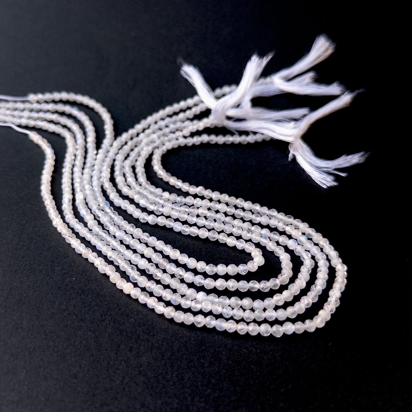 Authentic moonstone gemstone beads with polished faceted rondelle cuts, ideal for handmade jewellery components.