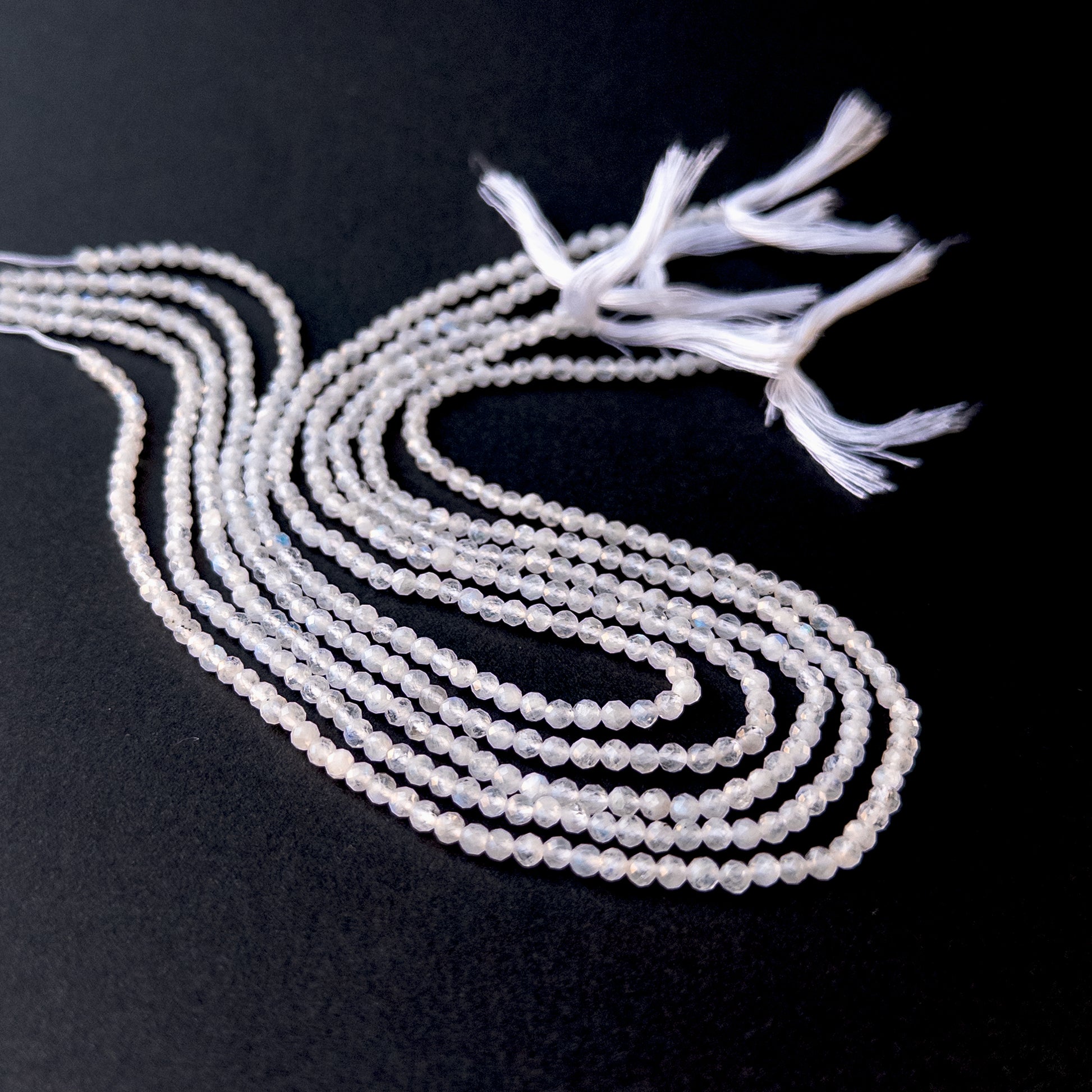 Authentic moonstone gemstone beads with polished faceted rondelle cuts, ideal for handmade jewellery components.