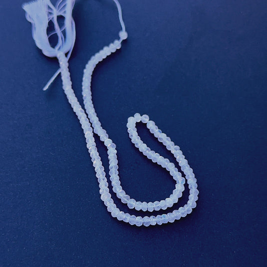 Close‑up of 3.8mm Moonstone stone beads showing sparkling facets and glowing tones ideal for natural gemstone beads for DIY jewellery.