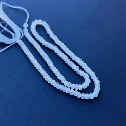 Delicate strands of Moonstone beads, showcasing their faceted design.

