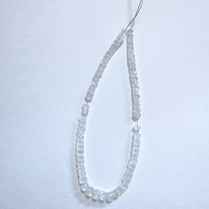 Moonstone faceted rondelle beads in 4-5.5mm size with soft shimmer and polished finish on a 20cm strand.