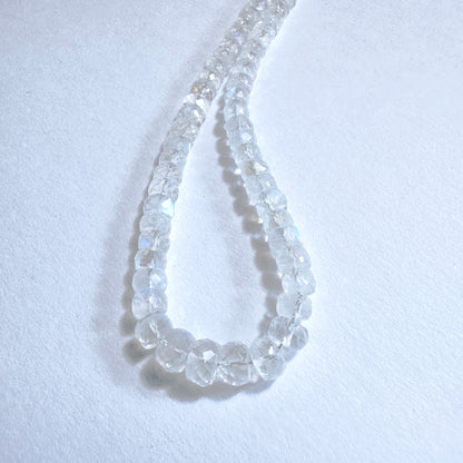 Stone Beads with iridescent glow and faceted rondelle shape, ideal for custom jewellery designs.