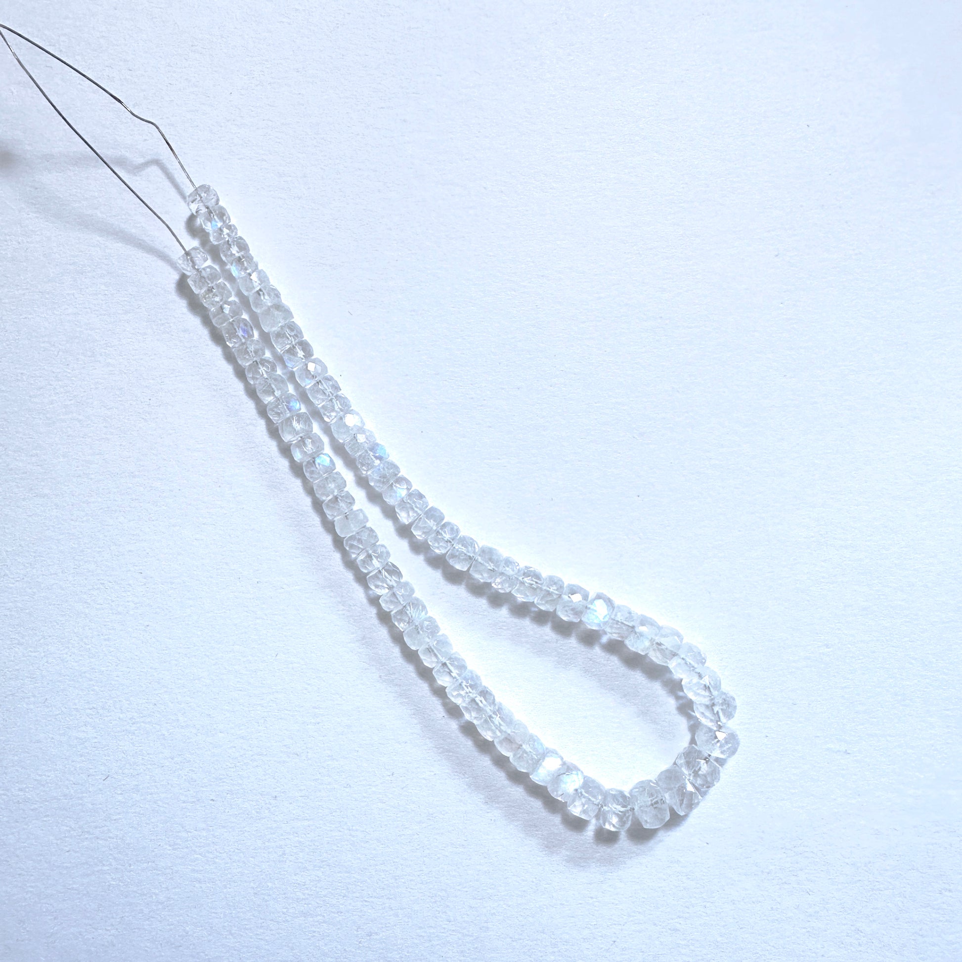 Australian gemstone bead supplier showcasing Moonstone beads with 0.5mm drill holes and consistent clarity.