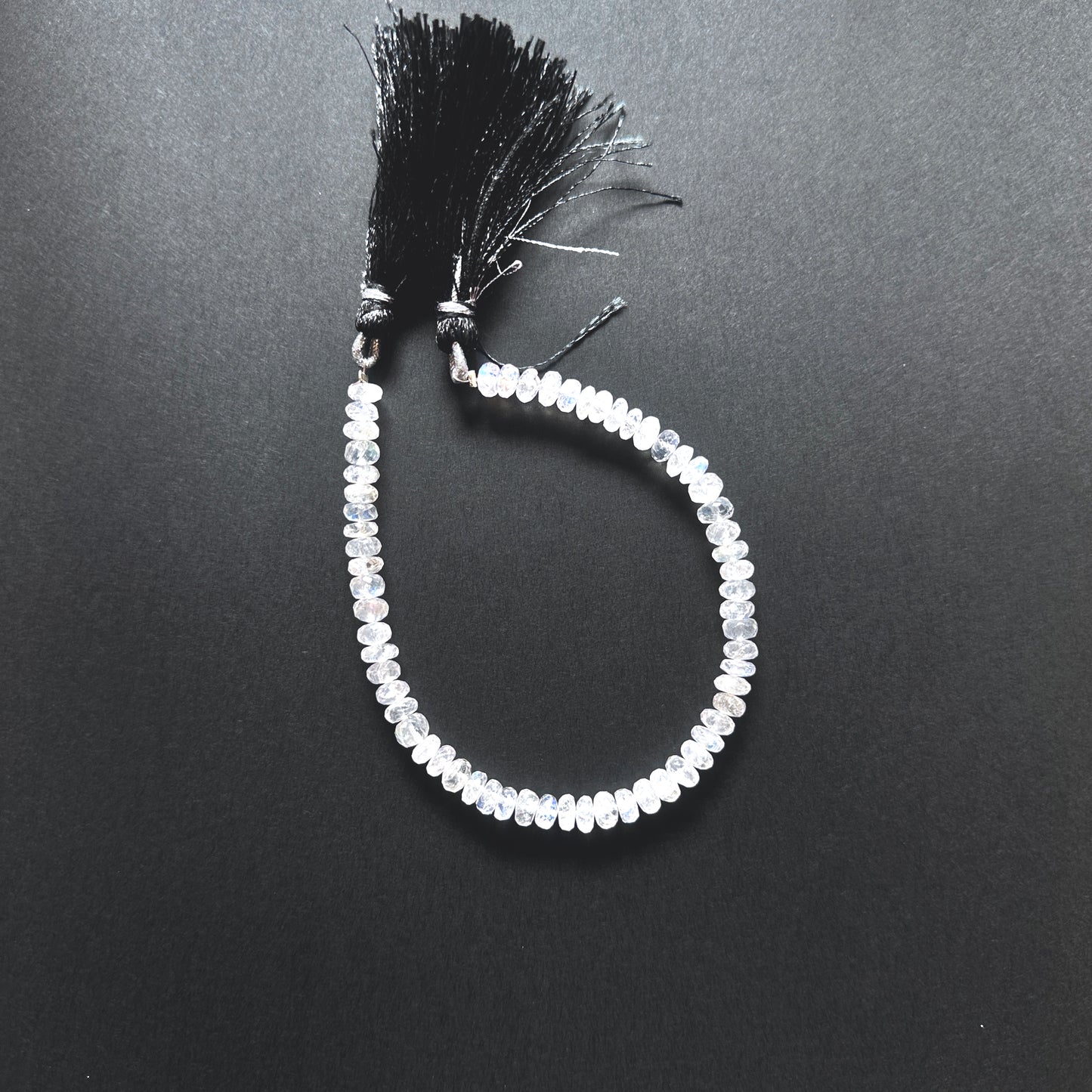 Natural gemstone beads for jewellery, highlighting the unique glow of Moonstone stones.
