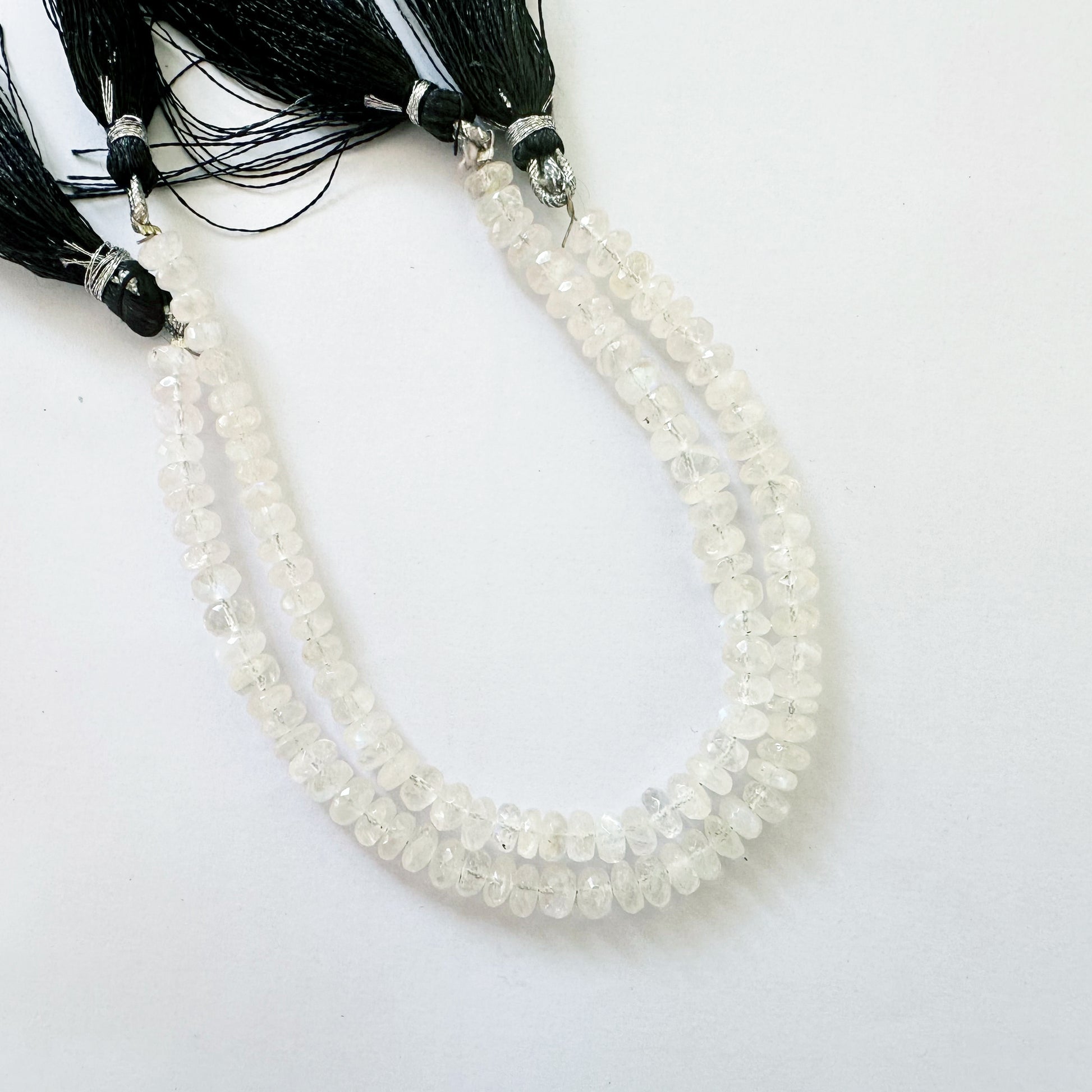 Moonstone rondelle beads in 6.3–6.5mm size with soft glow and faceted precision on a 20cm strand.