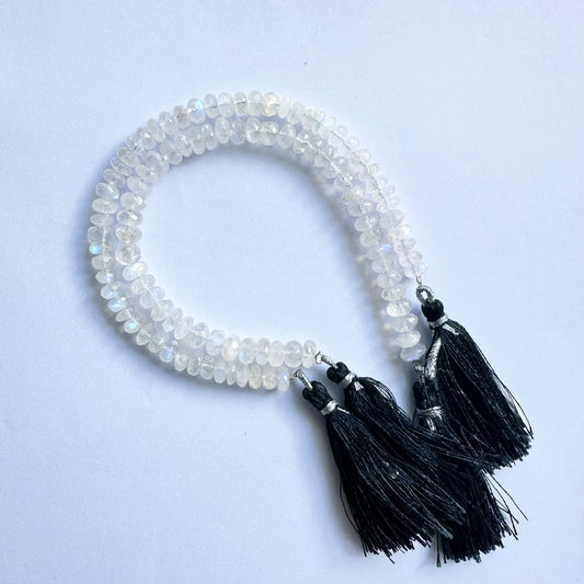 Close-up of Moonstone rondelle beads in 6.5–7.5mm size showing precise cut and clarity.