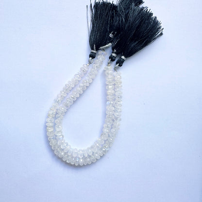 Moonstone beads with faceted rondelle cut arranged on a 20cm strand, glowing with soft hues.
