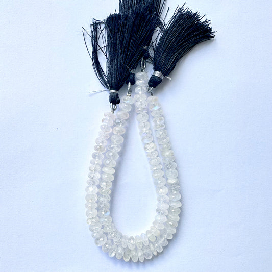 Close-up view of 7.2–7.5mm moonstone rondelle beads showing glossy finish and clarity.