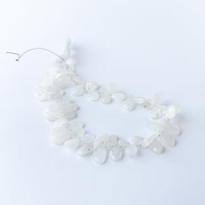 Rainbow Moonstone faceted briolette beads with natural glow, perfect for DIY jewellery makers using gemstone beads.