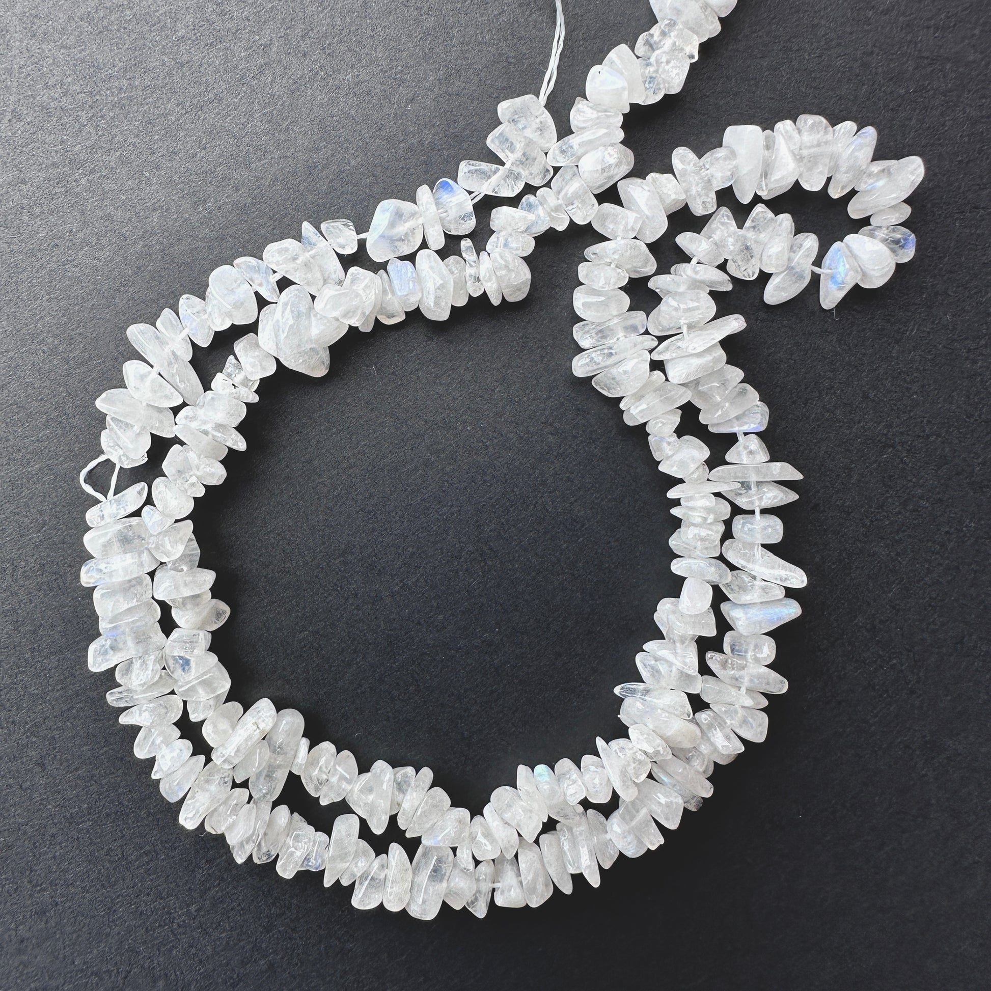 Moonstone stone beads with smooth chip cut and polished surface.