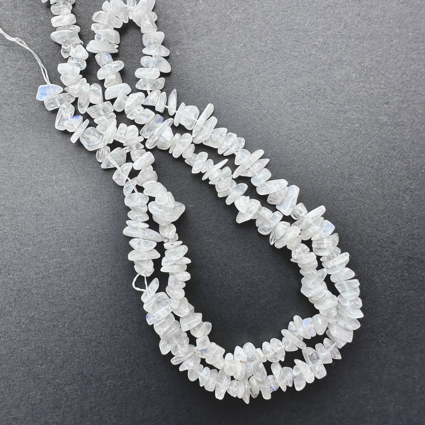 Natural gemstone beads in Moonstone, arranged on a 44cm strand with organic shapes.