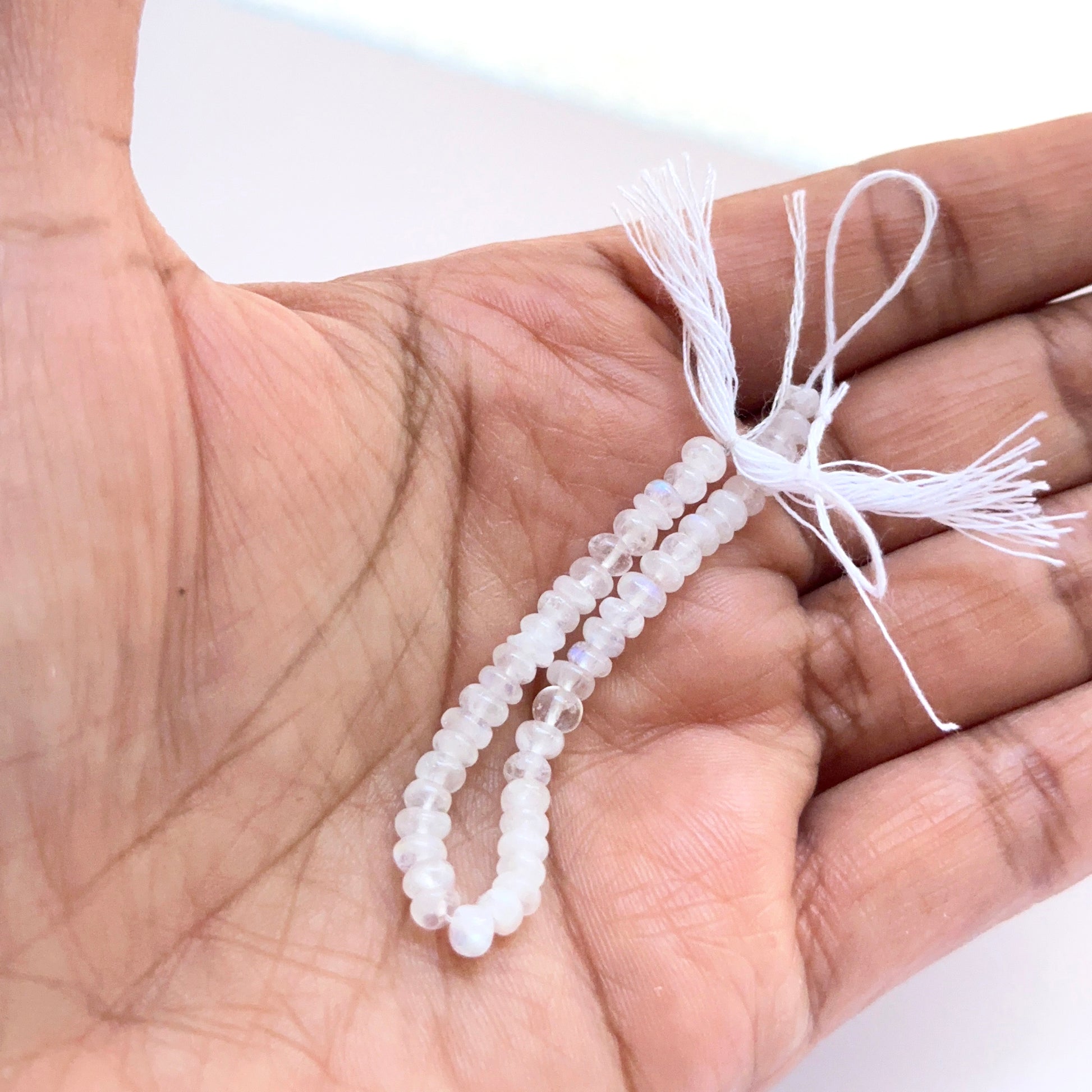 Close‑up of 3.8–4mm Moonstone stone beads showing polished surfaces and gentle shimmer ideal for natural gemstone beads for DIY jewellery.