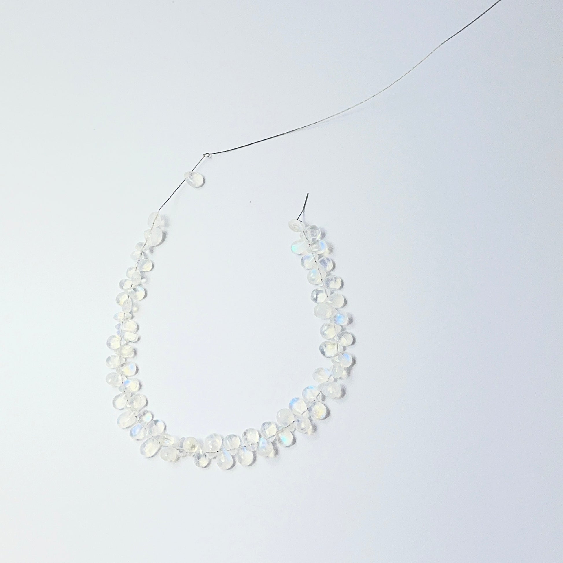 Detailed Moonstone 6–7mm × 4.5–5mm teardrops showing soft iridescence, ideal for gemstone beads for DIY jewellery.