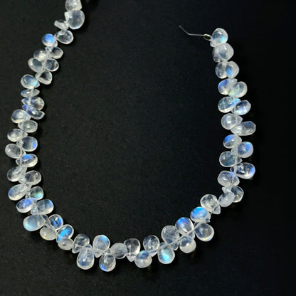 Moonstone smooth teardrop beads with soft glow, showcasing 6–7mm × 4.5–5mm stone beads ideal for DIY jewellery.