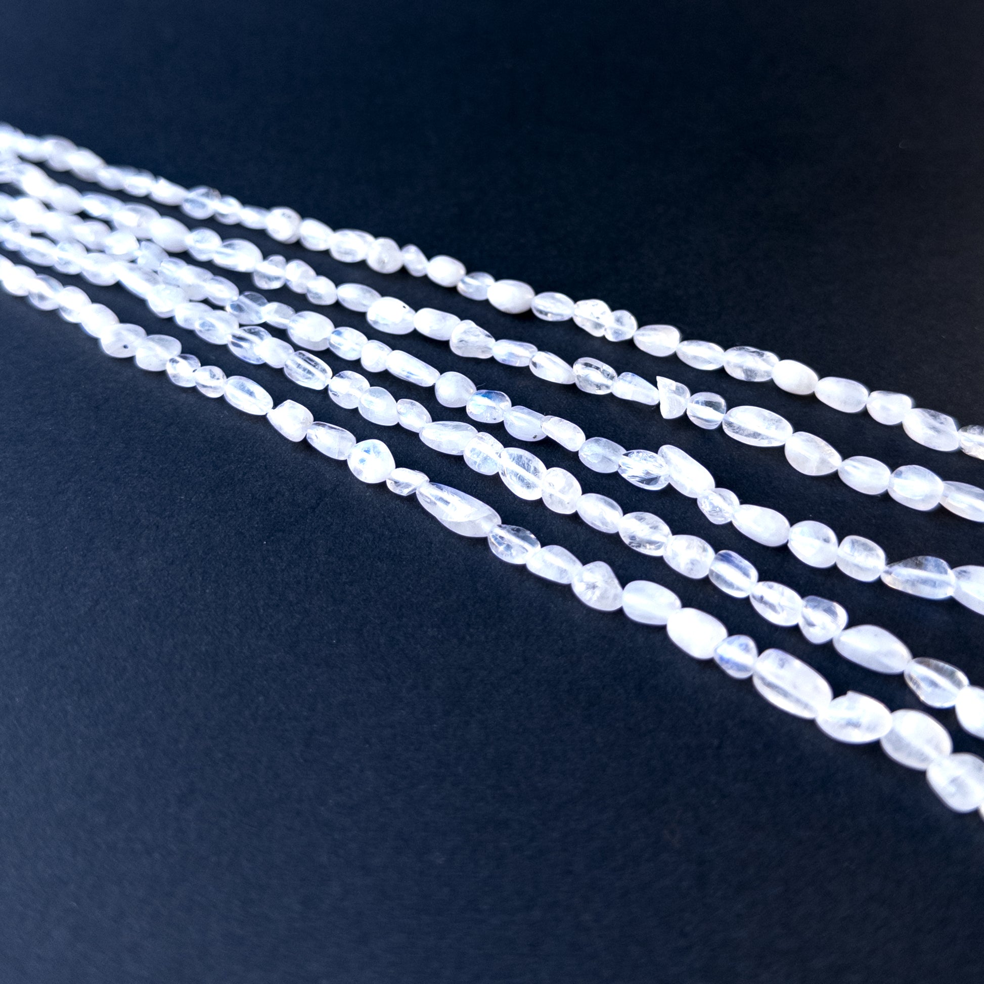 High‑quality moonstone tumble gemstone beads with gentle shine and natural adularescence on a long strand.