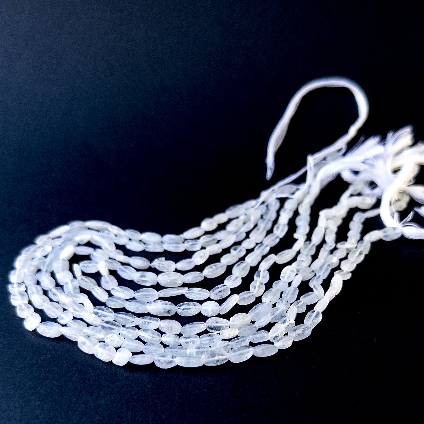 High‑quality moonstone tumble gemstone beads with gentle shine and natural adularescence on a long strand.