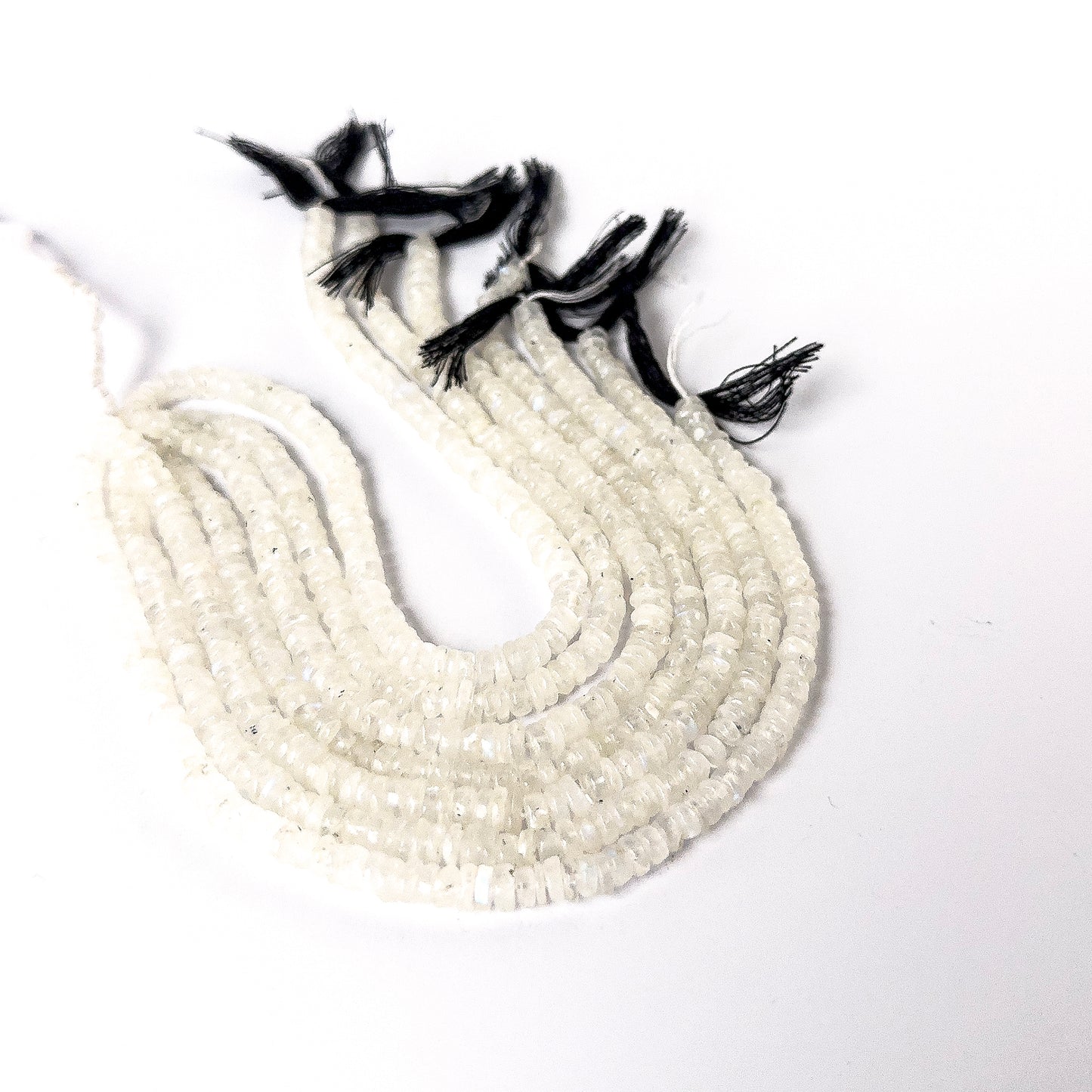 Close‑up of smooth wheel Moonstone beads with glossy finish, perfect for authentic gemstone bead jewellery.
