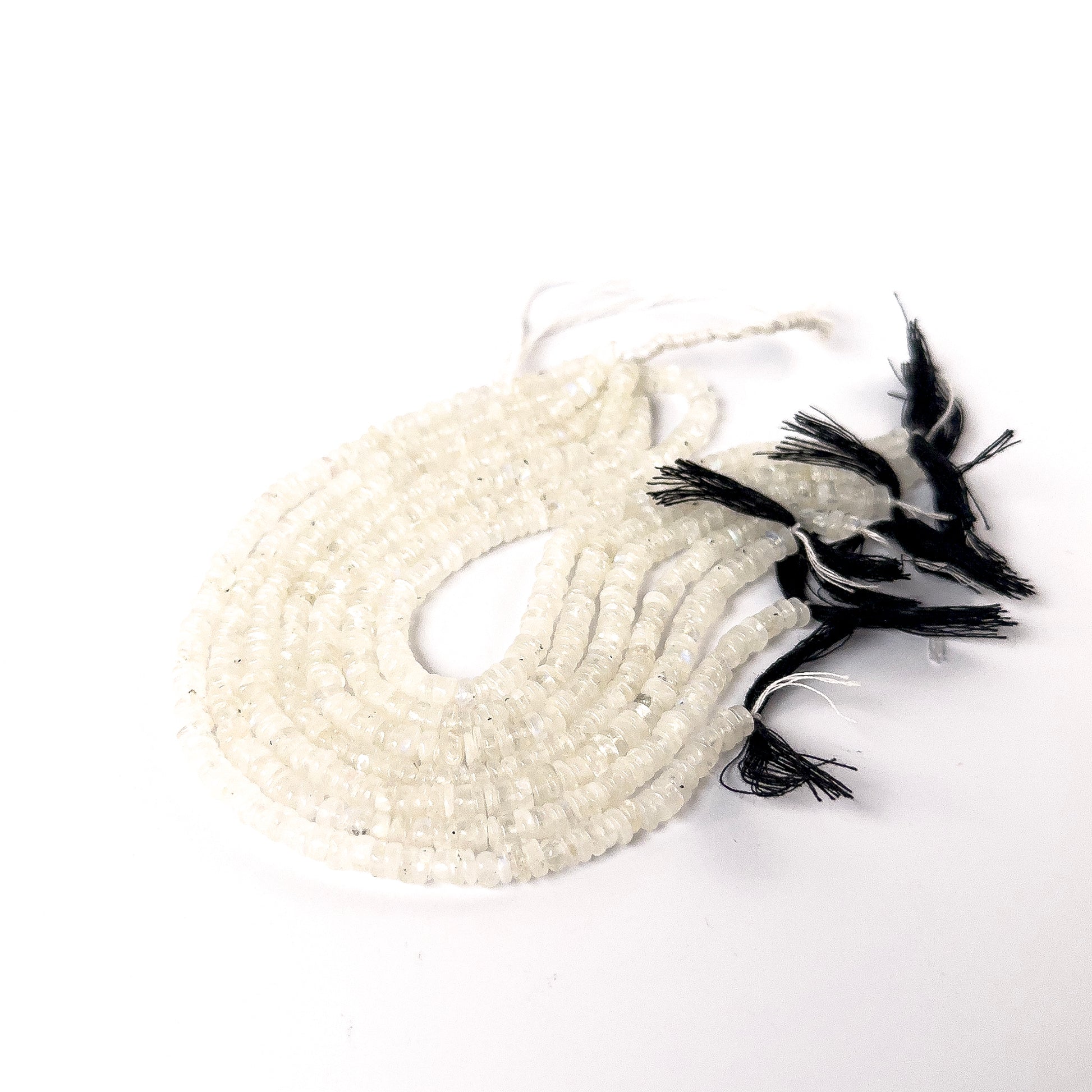 High‑quality Moonstone smooth wheel beads aligned on a 21cm strand for artisan jewellery designs.
