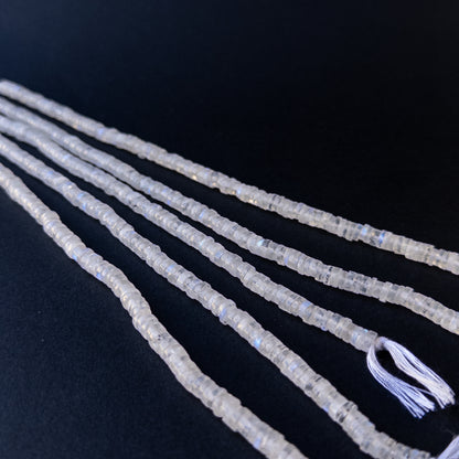 Premium moonstone gemstone beads for DIY jewellery, displaying smooth wheel cuts and subtle rainbow sheen.
