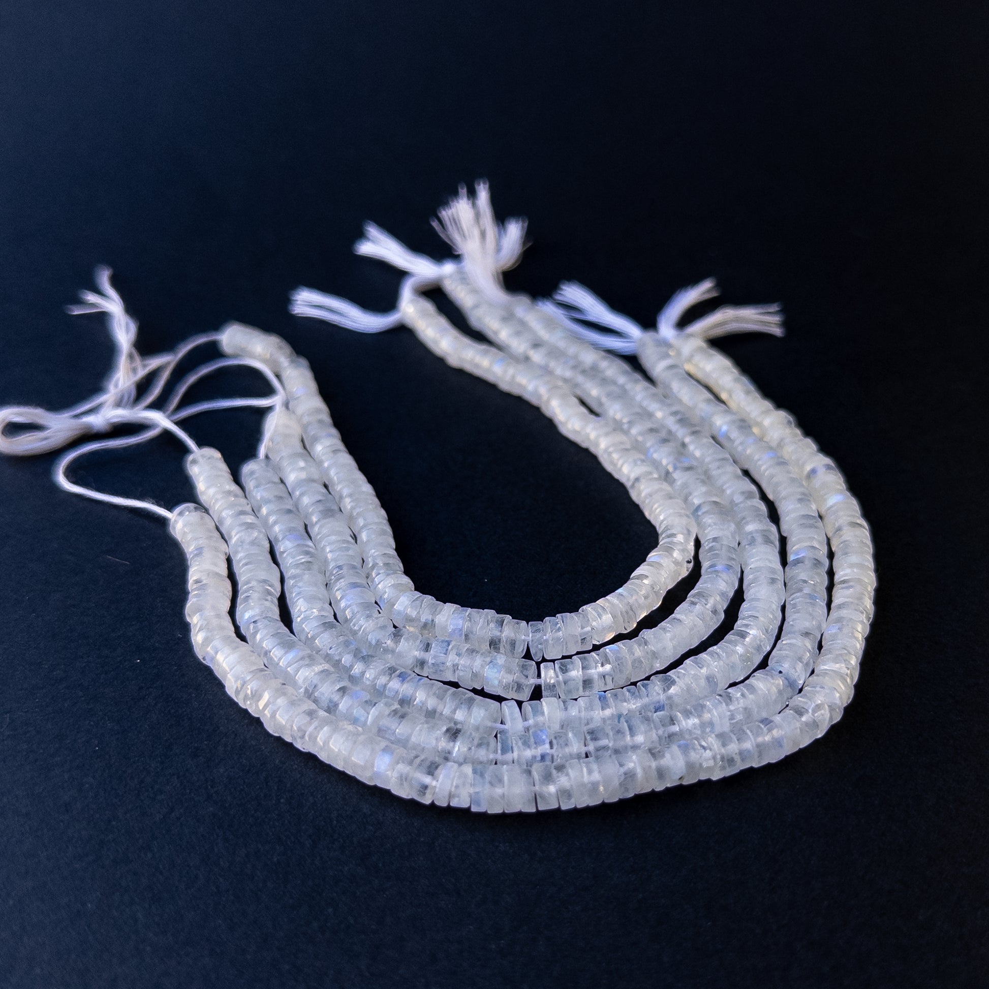 High‑quality moonstone wheel gemstone beads with gentle shine and natural adularescence on a short strand.