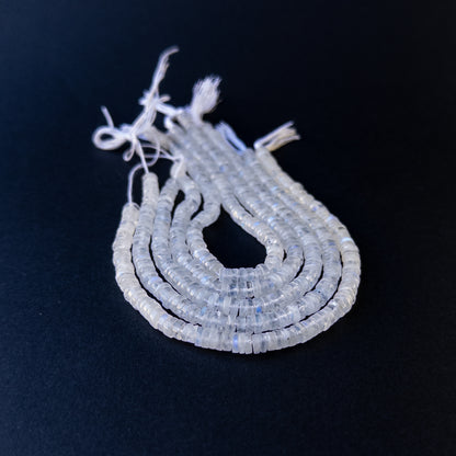 Handmade jewellery components featuring natural moonstone smooth wheels with luminous tones and polished glow.