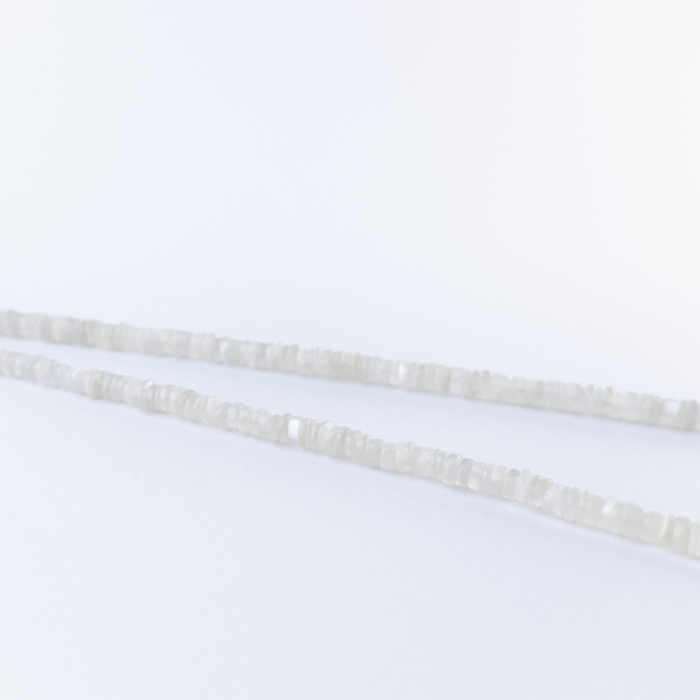 Moonstone smooth wheels arranged neatly, highlighting their soft colour tones and polished texture.