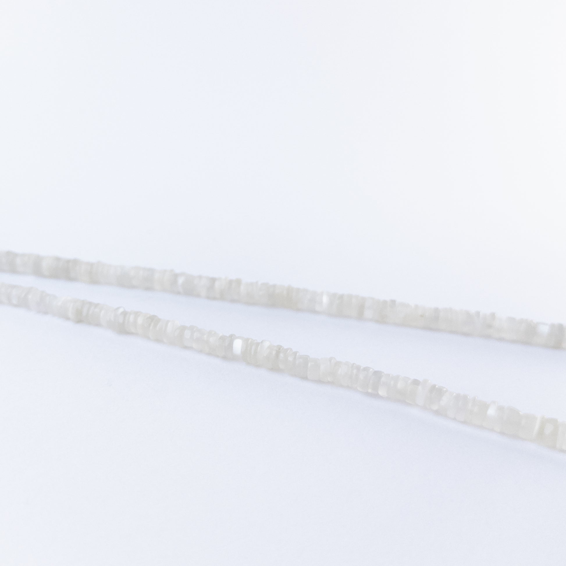 Moonstone smooth wheels arranged neatly, highlighting their soft colour tones and polished texture.