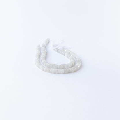 Moonstone smooth wheels displaying ethereal shimmer and premium craftsmanship in delicate beadwork.