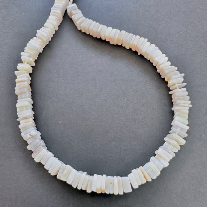 Natural gemstone beads in Moonstone, arranged on a 20cm strand with consistent cut.