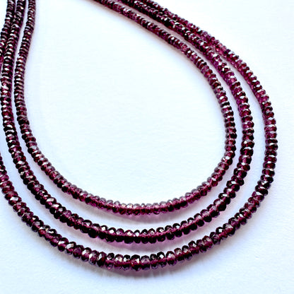 Mozambique Garnet stone beads in deep red tones arranged on a 36cm strand with smooth polished finish.