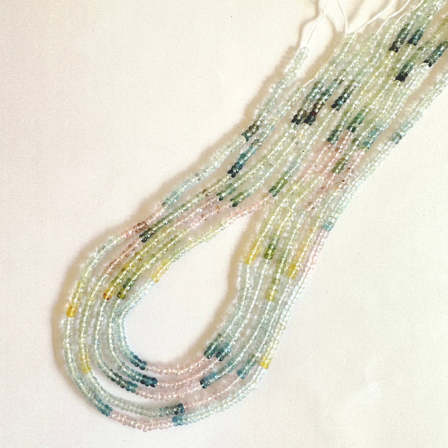 Strand of Aquamarine faceted rondelle beads showing harmonious colour and 0.4mm bead holes.