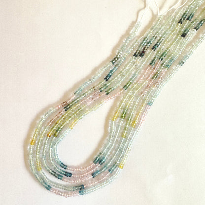 Strand of Aquamarine faceted rondelle beads showing harmonious colour and 0.4mm bead holes.