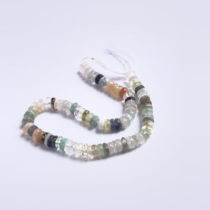 Stone beads in a strand of Multi Disco, highlighting their smooth wheels and 5.8–6mm size.