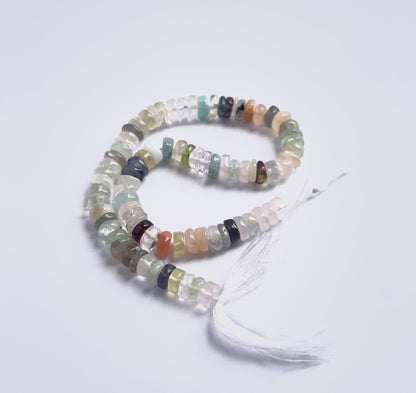 Handmade jewellery components featuring Multi Disco smooth wheel beads strung neatly together.